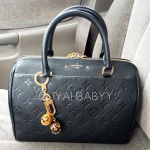Authentic Louis Vuitton Jack and Lucie Charm